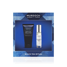 Murdock London Black Tea Ritual gift set, featuring a black body wash tube and a black tea cologne bottle presented on a blue geometric background card.