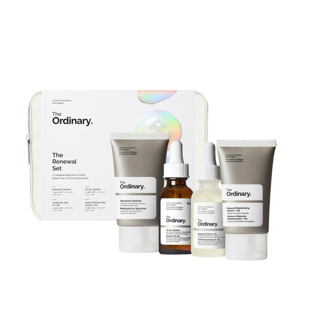 The Ordinary Renewal Set skincare collection including a white zippered case, a gray cleanser tube, a brown serum dropper bottle, a white toner bottle, and a white moisturizing cream tube, arranged on a white background.